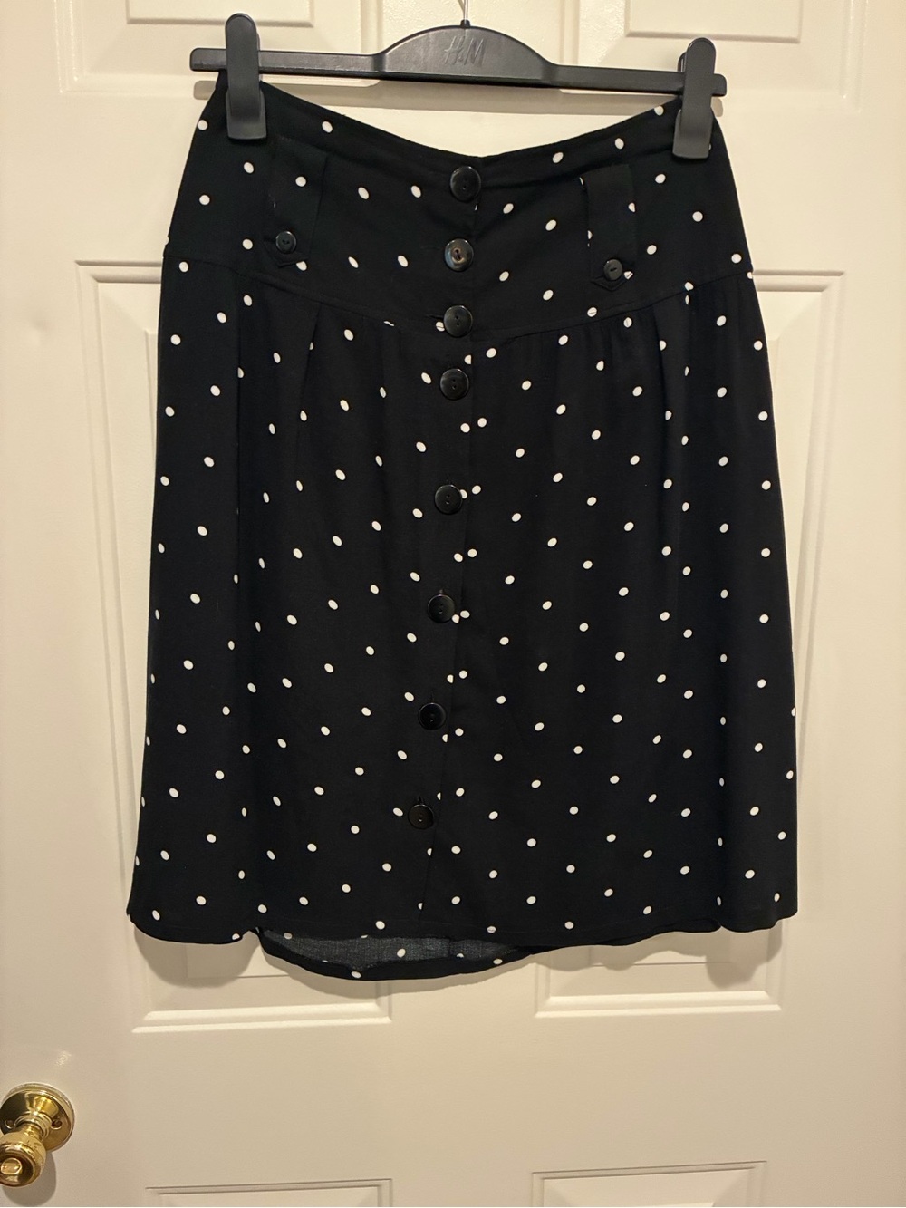 Women’s A-line button down skirt in dark navy/black.